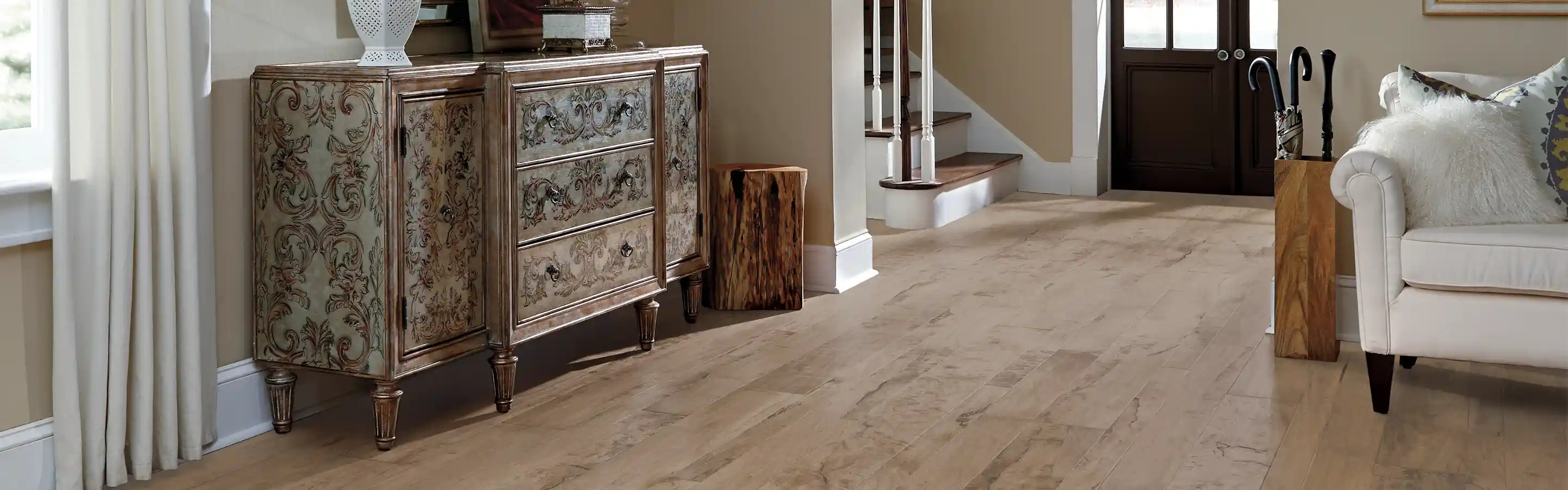 Hardwood entryway with white couch and fluffy pillow 